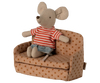 A small stuffed toy mouse in a red and white striped shirt and blue shorts sits on the PRE-ORDER: Sofa Bed, Mouse - Dots from SuitCasa, covered in brown polka-dotted fabric (Estimated Ship Date: Late September).