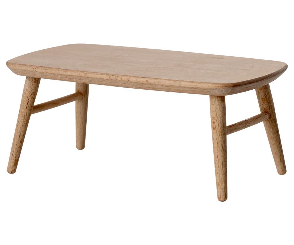 The PRE-ORDER: Coffee Table, Mouse - Nature features a small rectangular wooden design with rounded edges and four angled legs joined by crossbars—ideal for a Mouse hole Farmhouse. Estimated ship date is Early October.