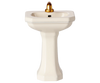 The PRE-ORDER: Bathroom Sink, Mouse Size - Off White (Estimated Ship Date: Early October) features a small off-white pedestal sink with a gold-tone faucet—ideal for SuitCasa or your mice siblings—shown on a plain background.