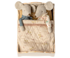 Two fabric mice, one with a blue checkered scarf and the other in a floral dress, are snug under a quilted blanket in the PRE-ORDER: Bed, Mouse - Off White (ships early October), creating a charming scene.