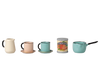 A PRE-ORDER: Maileg Kitchen Counter, Mouse (Approx. Ship Date: November) is shown with a cream pitcher, pastel mugs and saucers, a Pomodori tomato can, and a turquoise saucepan arranged on its small surface against a neutral background.