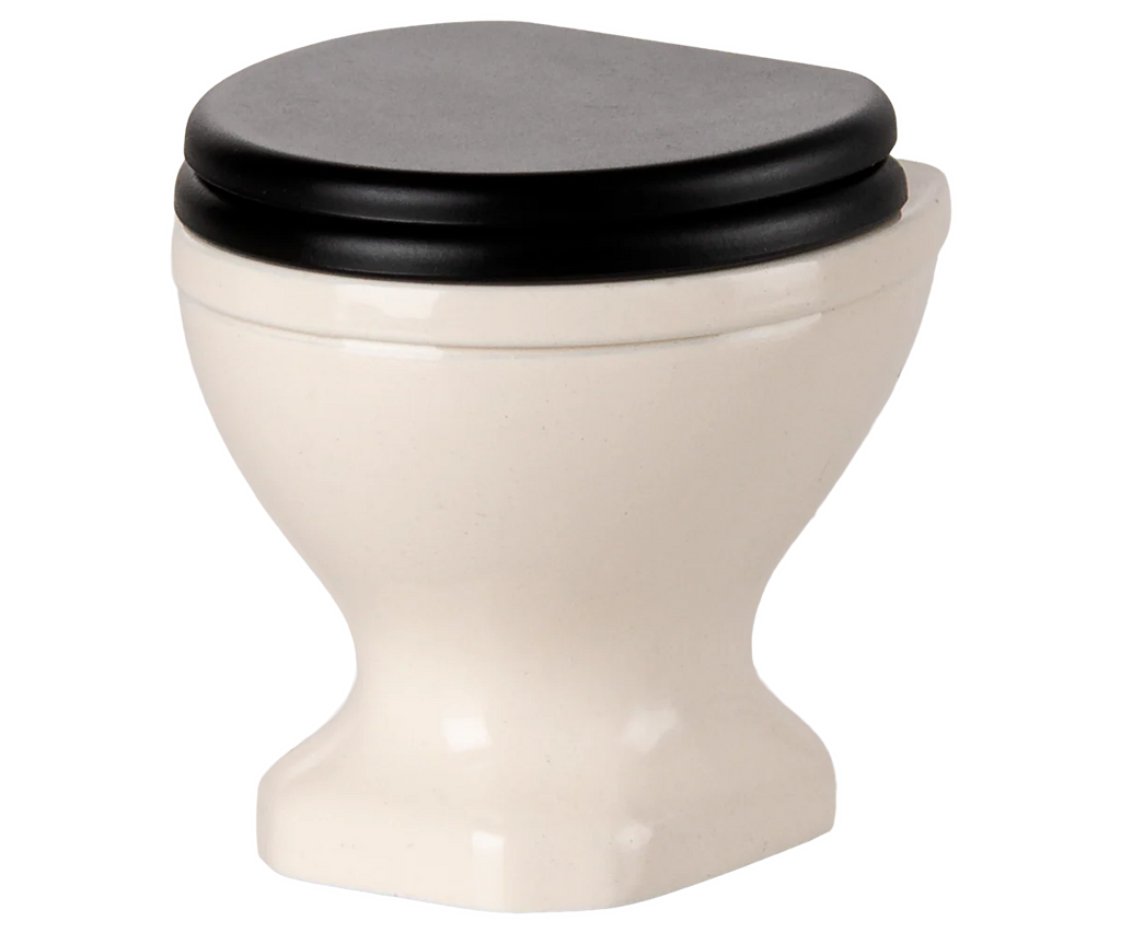 PRE-ORDER: Toilet, Mouse Size - Off White (ships early November). This mini white ceramic toilet features a black closed seat and lid, ideal for tiny mouse bathrooms or to complete your SuitCasa mouse house. Shown on a plain background.