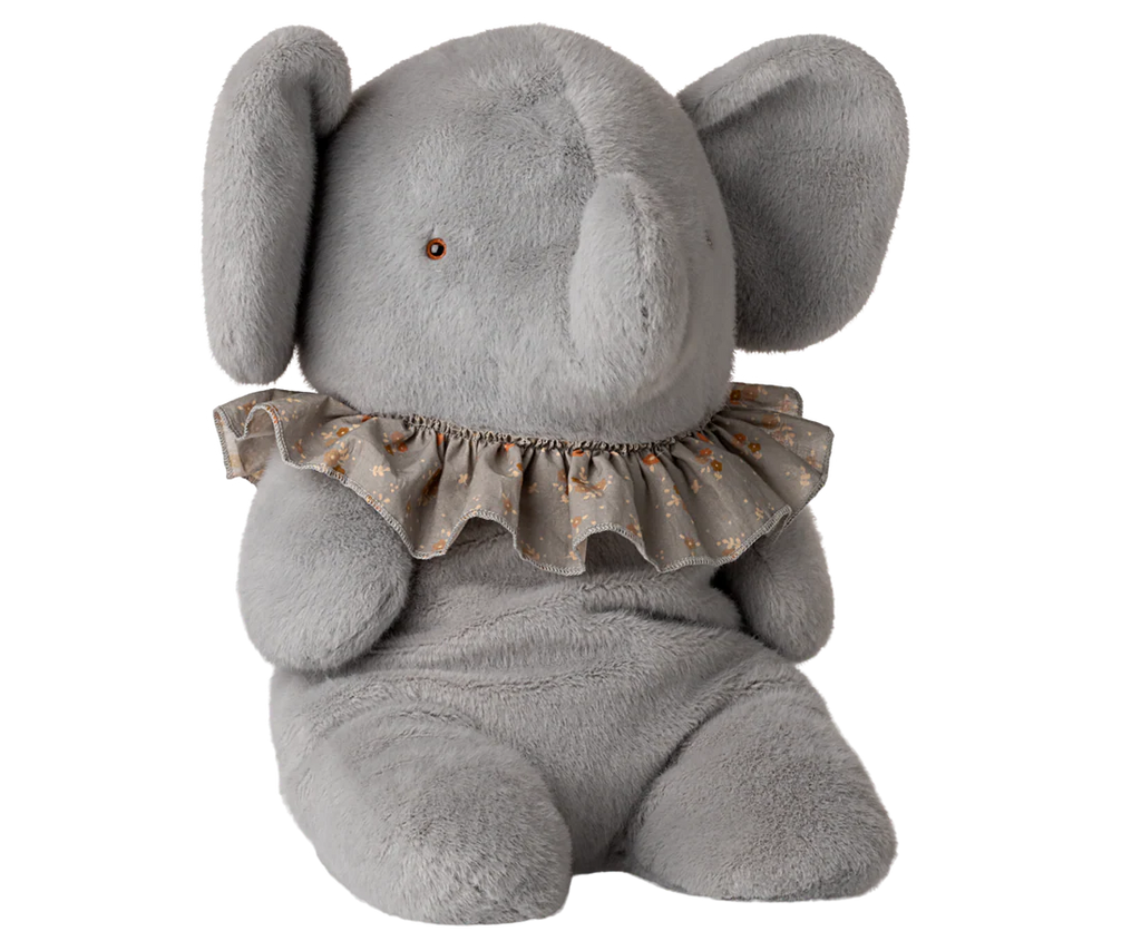 The PRE-ORDER: Elephant Plush, Big - Blue/Grey is crafted from soft plush and recycled polyester, with floppy ears, a small trunk, and a ruffled gray floral collar. Sits upright. Estimated ship date: Late November.