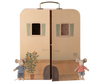 The PRE-ORDER: Maileg SuitCasa (Estimated Ship Date: Late November) is a mouse house-style suitcase with two windows, shown open with two small plush mice in striped shirts and denim shorts in front of it.
