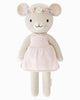 Cuddle + Kind Emma The Mouse is a soft, knitted doll handmade with hypoallergenic materials. She wears a pale pink dress and pastel flower crown, featuring embroidered facial details, pink blush on her cheeks, and rounded ears.