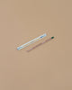 The Forget-Me-Knot Plantable Pencil – Eco-Friendly features a brown pencil with a green eraser and white-blue box, displayed on beige. It makes a perfect sustainable gift containing forget-me-not seeds for planting.