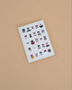 The Studious Cats Embroidered Journal features a white cover adorned with embroidered cats in playful poses and accessories, making it an ideal gift for any cat lover.