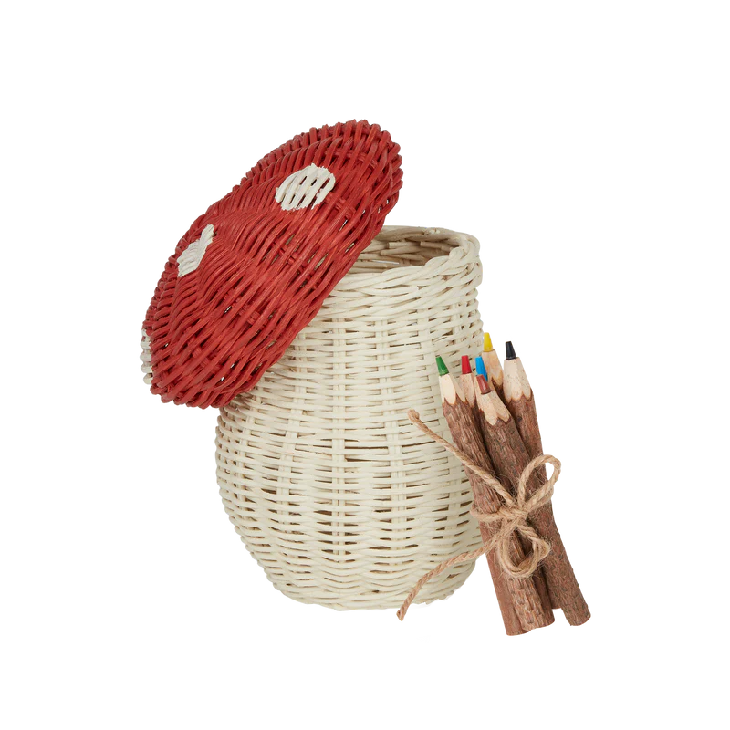 The Olli Ella Mushroom Basket With Coloring Pencils- Red features a woodland-themed, red mushroom-shaped lid with white spots and comes with coloring pencils tied with twine.