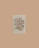The Maileg Living Room Starter Set includes a small, rectangular beige rug with fringe edges and an embroidered floral design in pastel pink, yellow, orange, and green on a light background—perfect for decorating your mice's living room.