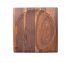 The Walnut Wood Spinning Plate is a square toy made from walnut wood, featuring a central circular groove, light and dark grain patterns, and a small logo in the bottom left corner. It is crafted to meet toy safety standards.