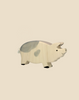 The Holtztiger Boar, a handcrafted wood toy with light gray spots and a small tail, stands on a plain beige background. Ships in one week.