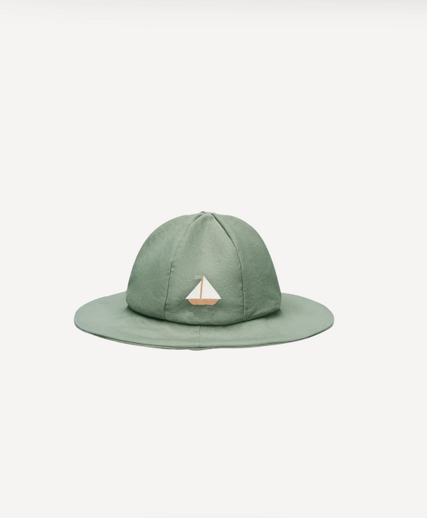 The Donsje Organic Cotton Steijn Boat Hat features a light green shade, wide brim, and small sailboat embroidery on the front, shown against a white background. Final Sale.