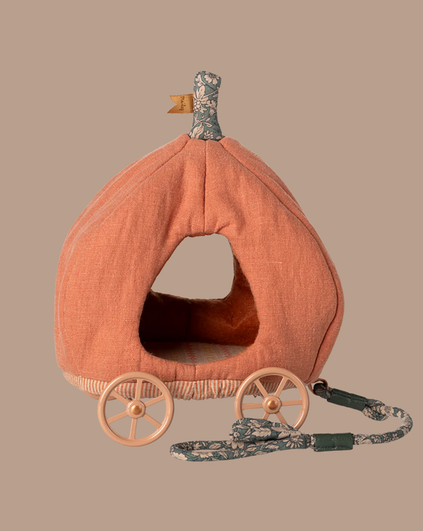 The PRE-ORDER: Maileg Pumpkin Carriage, Mouse is a soft orange pet bed with fabric wheels, patterned handle and roof—perfect for your royal mice family. Approximate ship date: Early October. Set against a plain taupe background.