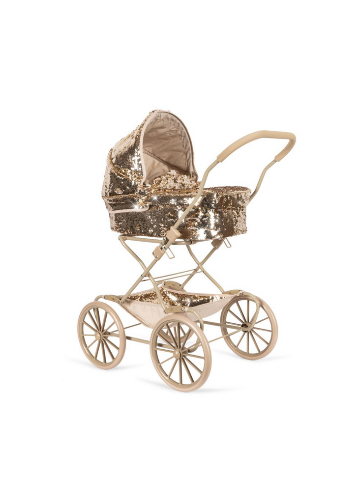 The Konges Sloejd Sparkly Doll Pram - Golden Cherry features large wheels, a handle, and a canopy and bassinet adorned with golden sequins, making it an elegant vintage-style piece perfect for collectors or display.