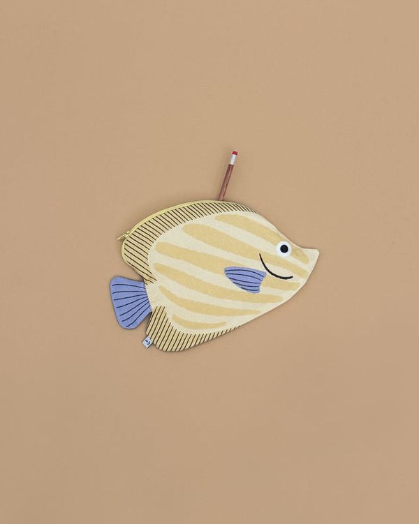The Butterfly Fish Pencil Case is yellow and cream striped, shaped like a fish with blue fins and tail, features a zipper, and has a pencil partially inside, shown on a plain beige background.