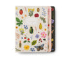 The Assorted Set of 3 Curio Notebooks features decorative covers with flowers, beetles, a butterfly, and a ladybug. The front gold foil notebook has a white background with "Notebook" centered on the cover.