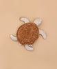 The Senger Naturwelt Cuddly Animal - Turtle, with a soft brown shell and beige flippers, made from organic cotton as a grain pillow, is displayed on a plain light brown background.