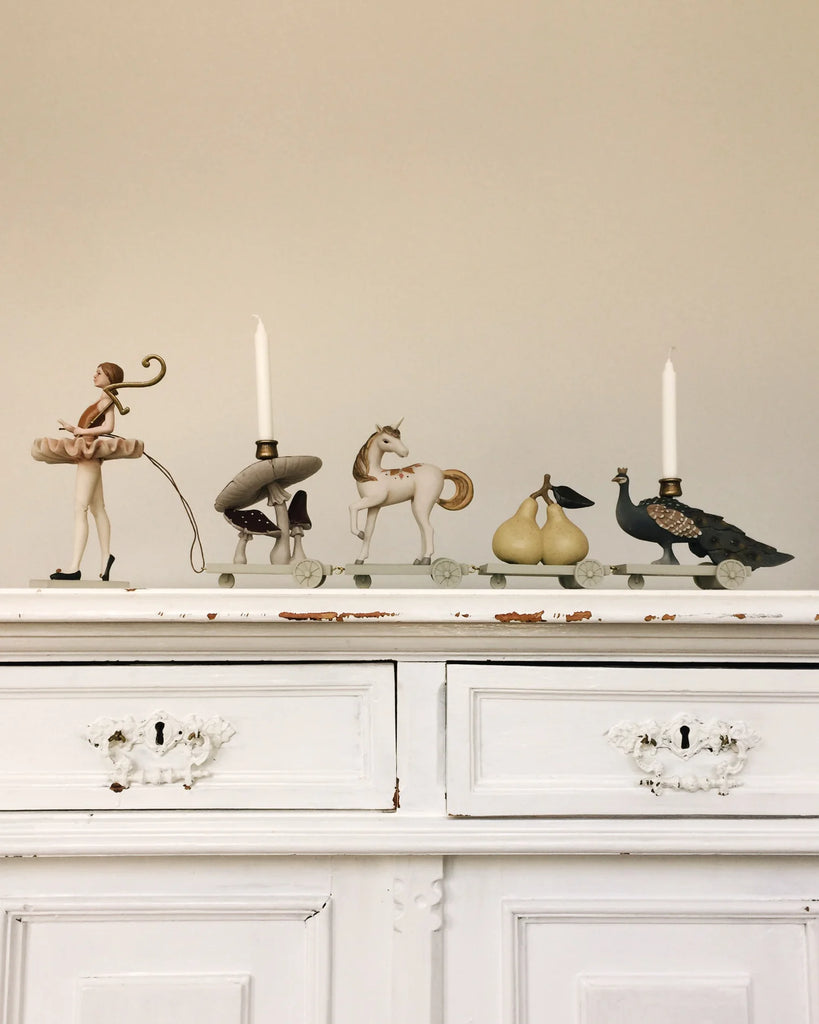 polyresin train of animals and figurines holding candles and numbers