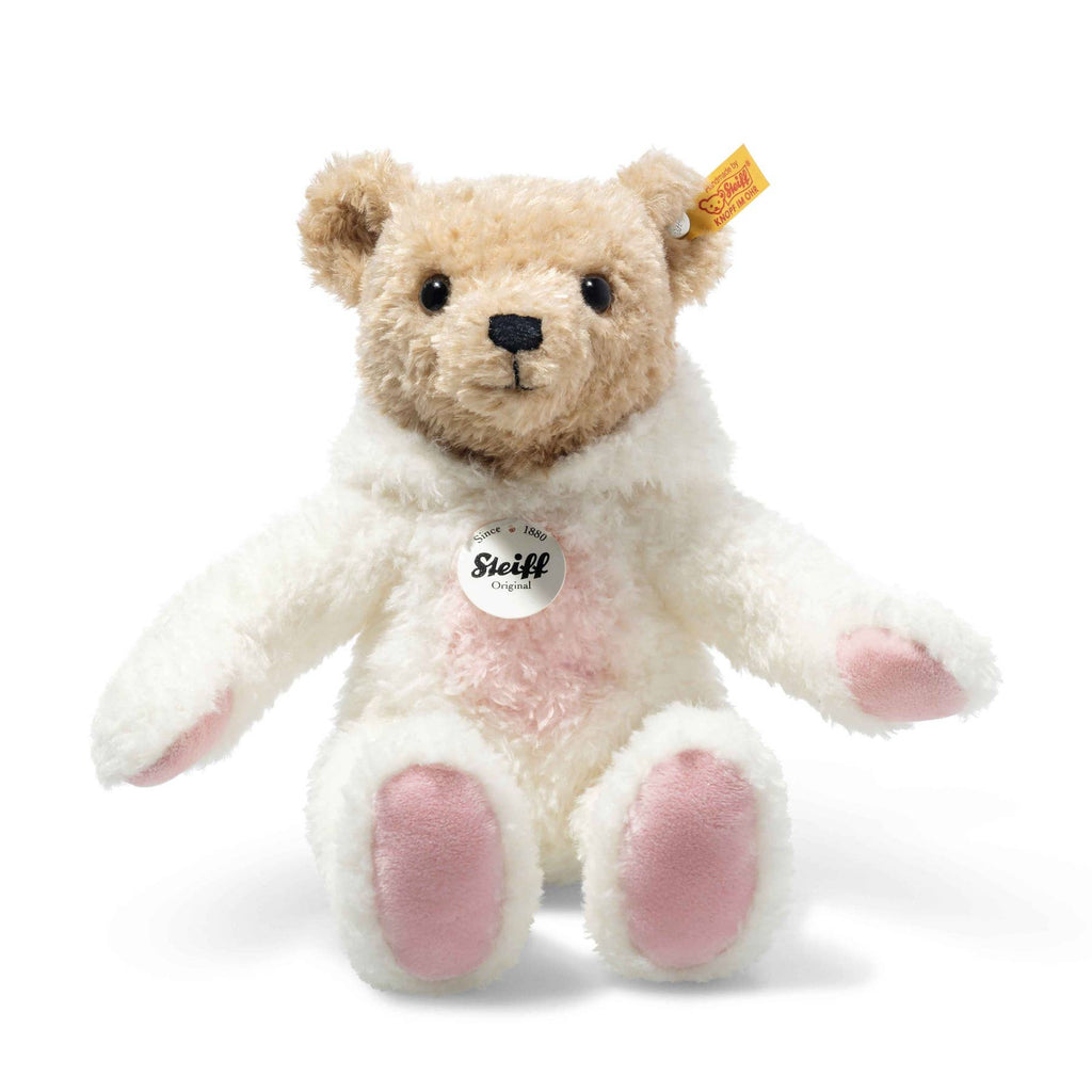 The Steiff Teddy Bear with Bunny Hoodie Costume, 11 Inches, features a light brown head, fluffy white body, pink paw pads, button eyes, black nose, and the signature yellow Steiff tag in its left ear.