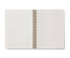 The Curio Spiral Notebook features ruled pages and blank white sheets in an open, spiral-bound design, shown from above on a white background.