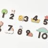 The Magnetic Number Play Set includes ten colorful magnetic numbers with cute cartoon designs like a lion, rainbow, and dinosaur. Pair this set with wooden toys or alphabet cards for an engaging way to make learning fun.