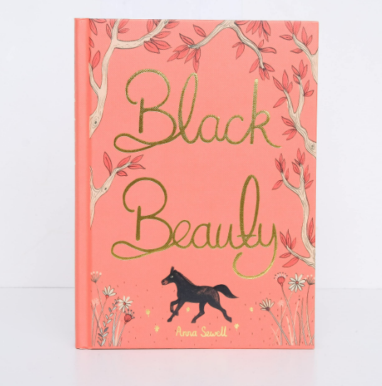 The "Black Beauty | Collector's Edition | Hardcover" has a coral-pink cover with gold cursive lettering, illustrated tree branches, flowers, and a small black horse at the bottom.