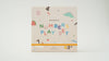 The Magnetic Number Play Set comes in a playful white box decorated with colorful numbers, cheerful faces, a dinosaur, fruit, and a yellow elastic band. This magnet puzzle set is ideal for children ages 3 and up.