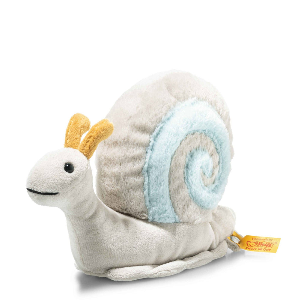 Meet the Steiff Snaily Snail Stuffed Plush Animal, 8 Inches—featuring a light beige body, blue-and-white spiral shell, yellow antennae, black eyes, a smiling mouth, and yellow tag. A charming addition to your plush collection!.