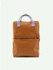 A Sticky Lemon Backpack | Uni | Buddy Brown with a front YKK zipper pocket and purple handles against a plain white background.