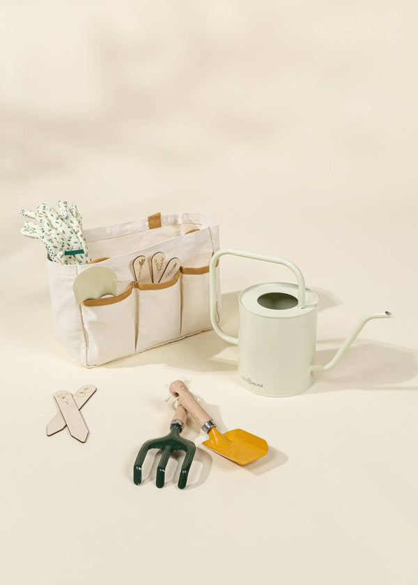 The Gardening Tools Playset includes a canvas bag with handles, gloves, trowel, fork, watering can, plant markers, and a yellow rake—everything young gardeners need for educational outdoor fun.