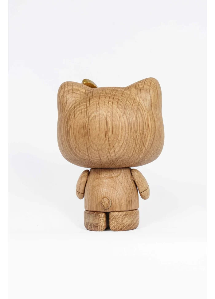 Celebrate Hello Kitty's 50th Anniversary with this limited edition Boyhood figurine—crafted in wood with simple, rounded details, it stands upright facing away on a white background, capturing classic collectible charm.