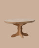 The PRE-ORDER: Oval Dining Table, Mouse - Nature features a light wood finish, single pedestal base with two curved supports, and an elegant oval shape. Perfect for a cosy dinner party. Estimated ship date: Early October.