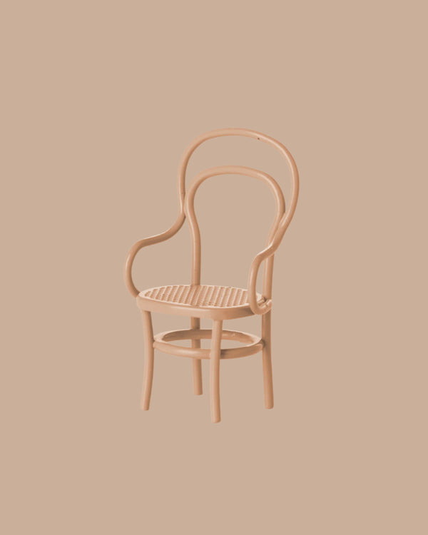 A dark powder vintage mouse-size chair with curved armrests and backrest, set against a solid beige background. PRE-ORDER now for estimated shipping in late September.