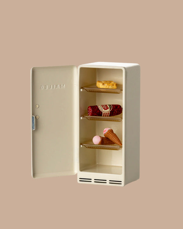 The PRE-ORDER: Fridge, Mouse - Off White (ships early October) is a charming small fridge with three shelves holding treats—ideal for imaginative play in any Maileg Mouse hole Farmhouse scene.