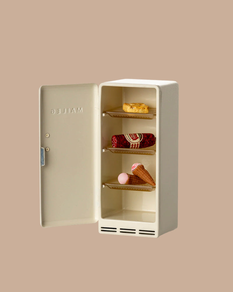 The PRE-ORDER: Fridge, Mouse - Off White (ships early October) is a charming small fridge with three shelves holding treats—ideal for imaginative play in any Maileg Mouse hole Farmhouse scene.