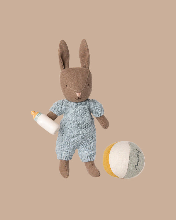 PRE-ORDER: Rabbit Set, Micro - Brown - Blue includes a plush bunny in a blue outfit with a baby bottle and a soft round ball in white, yellow, and gray—perfect for rabbit collections or storytelling. Estimated ship date: Early November.