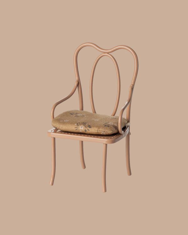 A vintage mini chair in dark powder pink with an ornate curved backrest and beige floral cushion, perfectly sized for a bunny or rabbit, set against a plain beige background. PRE-ORDER now—ships early October.