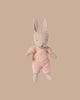 The PRE-ORDER Rabbit Micro - Sand in a rose knitted suit (ships early October) sits upright on a plain beige background—ideal for House of Miniature dollhouse displays or pairing with Maileg accessories.