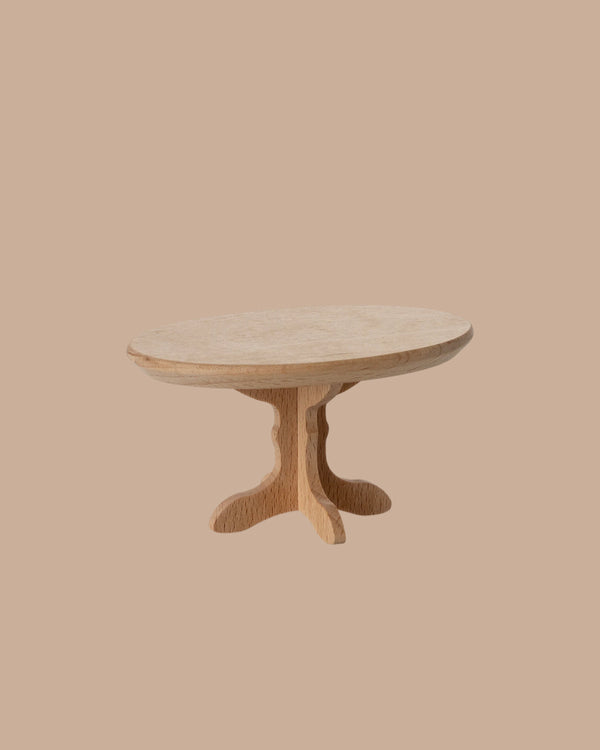The PRE-ORDER: Oval Coffee Table, Mouse - Nature (ships early October), features a sleek wooden pedestal base and is displayed against a plain beige background.