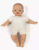 The Minikane Soft Body Doll (11") - Liv, featuring light skin, blue eyes, and a wide smile in a white outfit, is displayed on a plain white background.