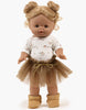 A brown-skinned Minikane doll with light brown hair in two buns, wearing the Josepha Set: a pink flower bodysuit and brown tutu. The doll stands upright in tan boots against a plain white background. Outfit is hand washable.