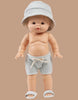 A Minikane doll models the Emile & Ida Sun 3-piece Swimsuit Set in Terrycloth - Green Tea, standing against a plain beige background.