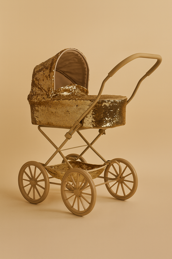 The Konges Sloejd Sparkly Sequin Doll Pram - Golden Cherry features a vintage design with golden sequins, large wheels, and an arched handle, displayed against a monochromatic beige background.