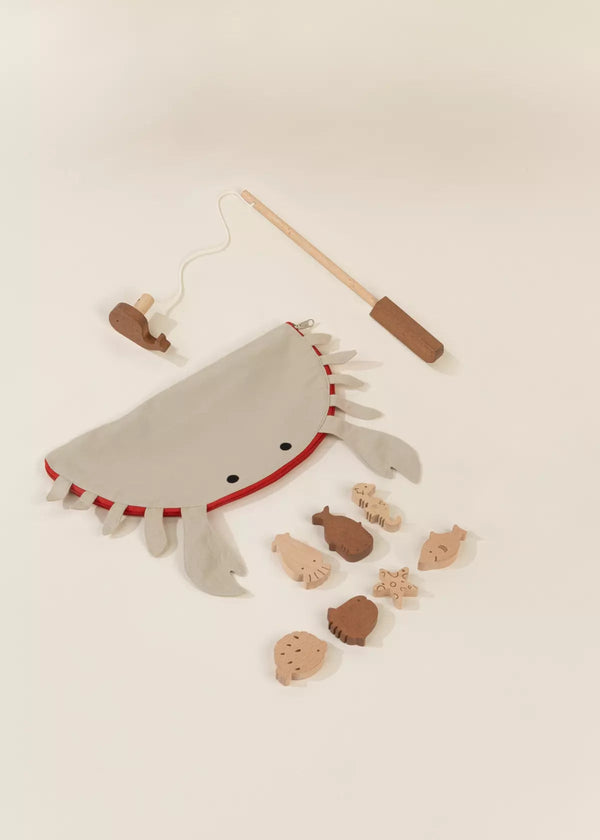 The Wooden Fishing Game with Bag features a crab-shaped pouch, wooden sea animal pieces, and a magnetic fishing rod—with endless fishing fun that encourages cognitive development in little ones.
