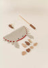 The Wooden Fishing Game with Bag features a crab-shaped pouch, wooden sea animal pieces, and a magnetic fishing rod—with endless fishing fun that encourages cognitive development in little ones.