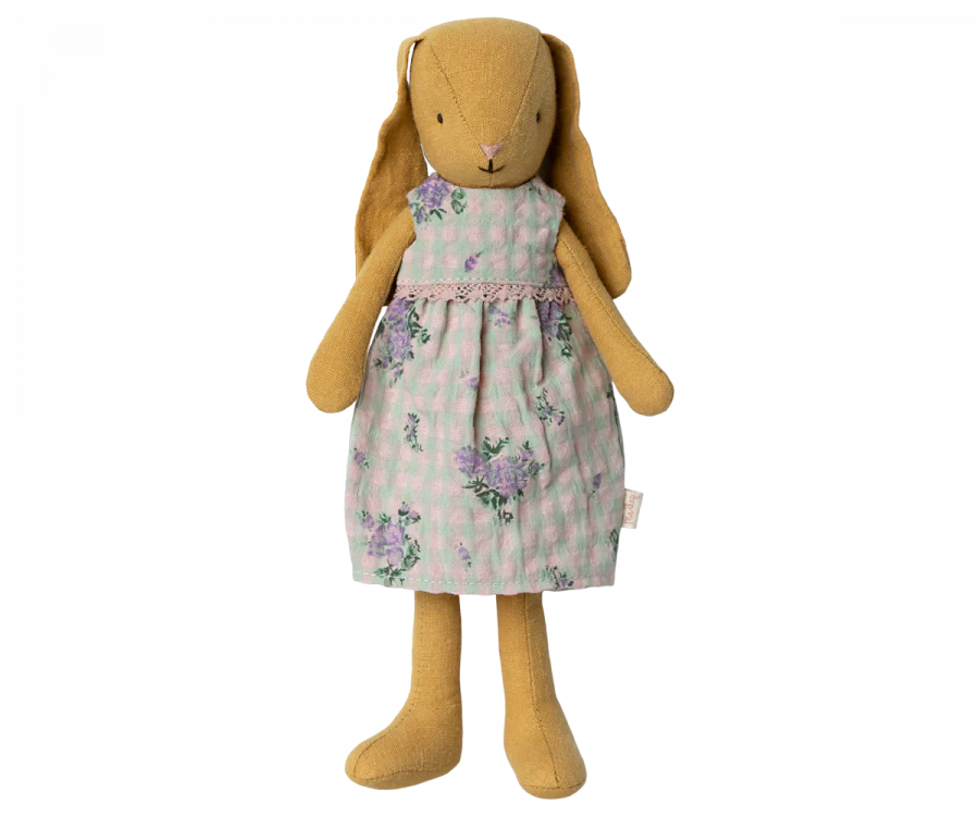 A soft Maileg Bunny Size 2 in dusty yellow, featuring long ears and stitched facial details, dressed in a pretty dress—perfect for dollhouse displays or imaginative play.