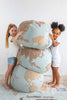 World shaped poufs stacked