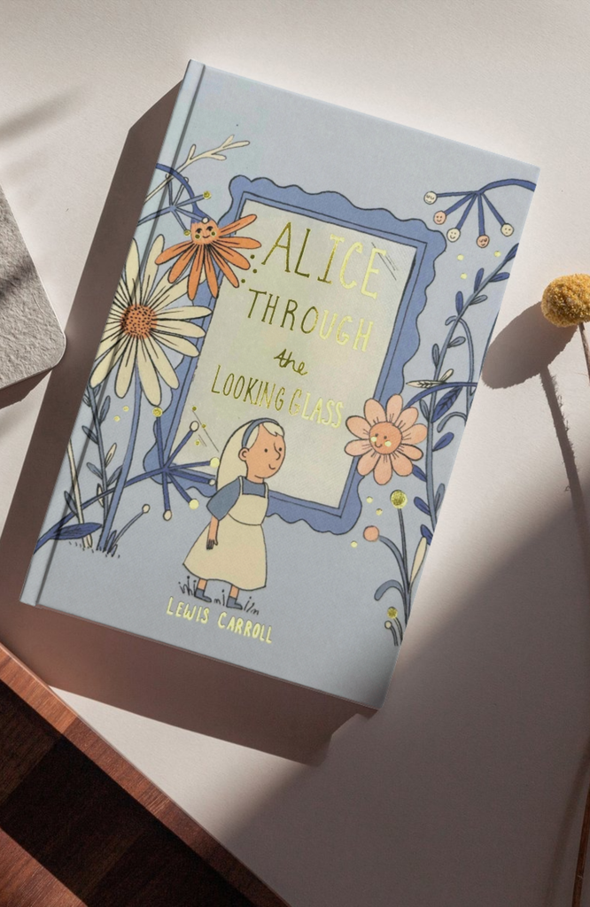 Cover of "Alice Through the Looking Glass: Collector's Edition" by Lewis Carroll, featuring a whimsical illustration inspired by Sir John Tenniel, showing a girl amidst large flowers on a light blue background with sunlight casting soft shadows.