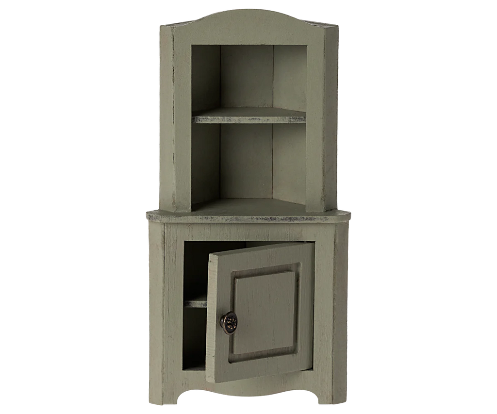This charming vintage-style gray wooden corner cabinet perfectly complements the Maileg Dining Starter Set. It features an open upper section with two shelves and a slightly ajar lower door, offering rustic, worn-look storage for small parts.