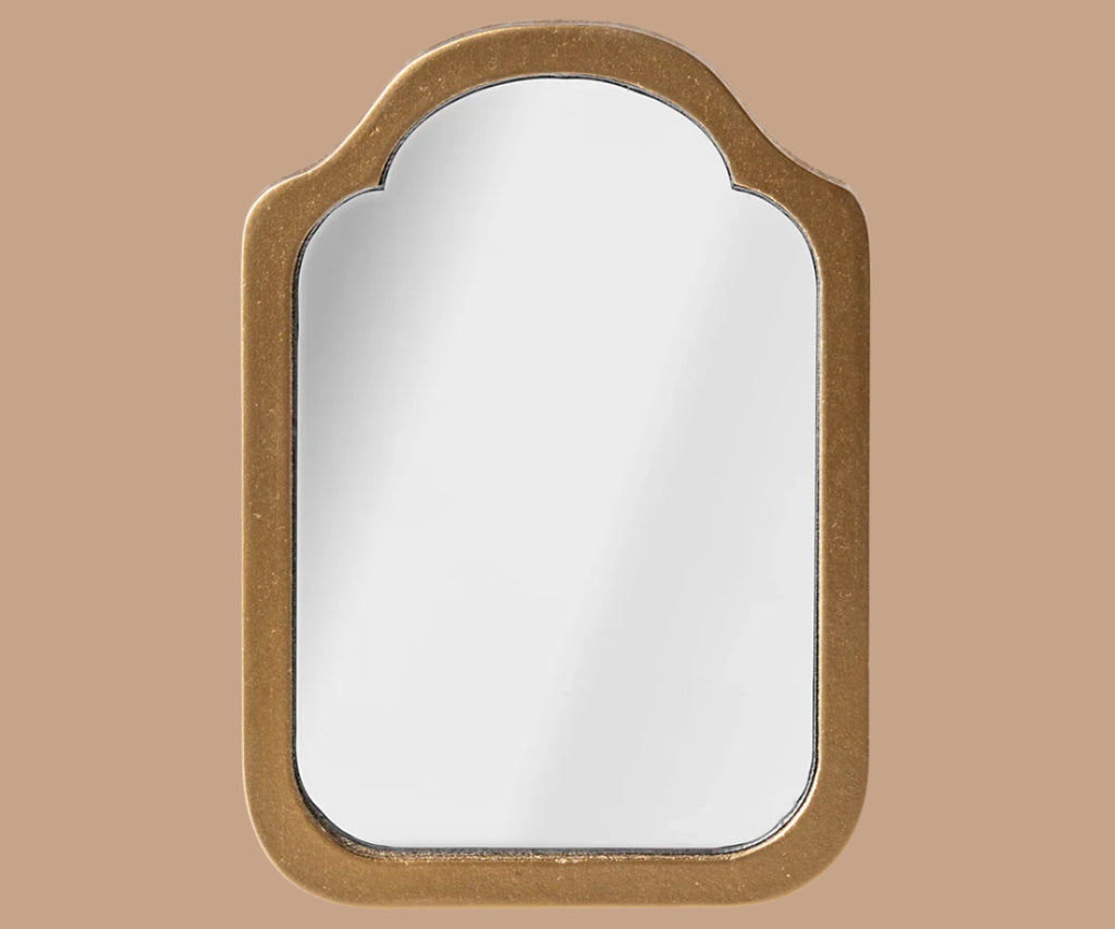 The Maileg Living Room Set features a decorative mirror with a gold, arched frame and rounded corners, displayed against a light brown background.